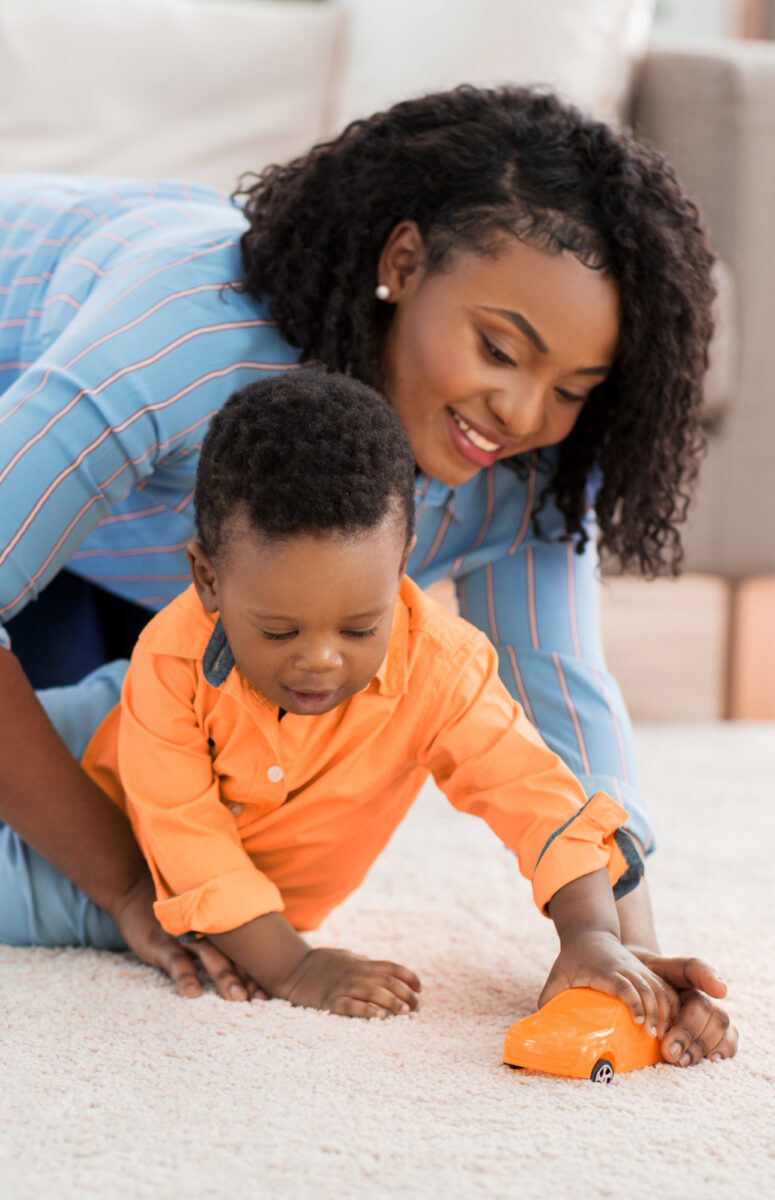 mom paying with toddler son