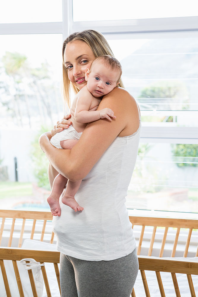 mom holding newborn baby
